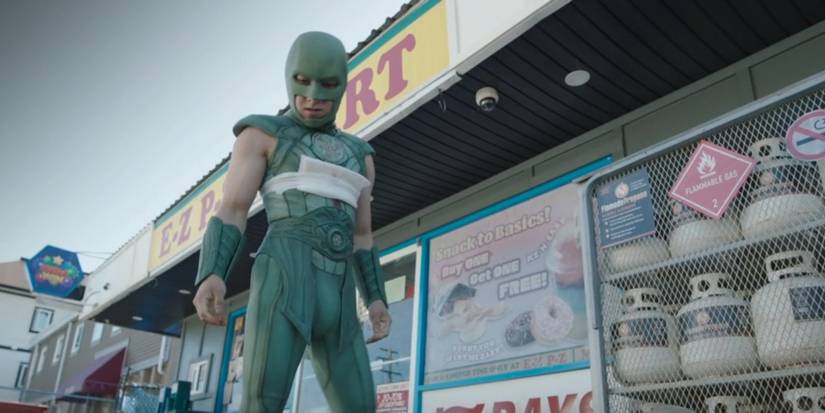 Judomaster stands outside of a convenience store in Peacemaker Episode 7