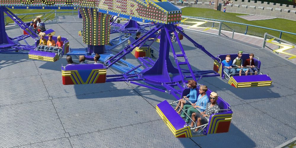 Guests Riding the Thril Ride Scizzer in Planet Coaster: Console Edition.