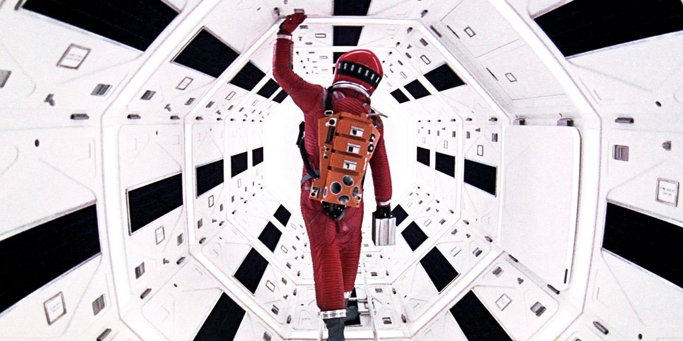 2001 A Space Odyssey's David Bowman wearing a red spacesuit onboard a spaceship.