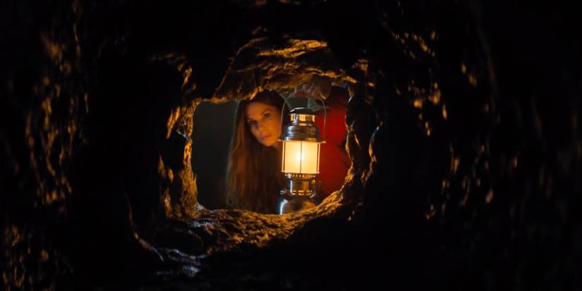 Loretta examining a hole in The Lost City