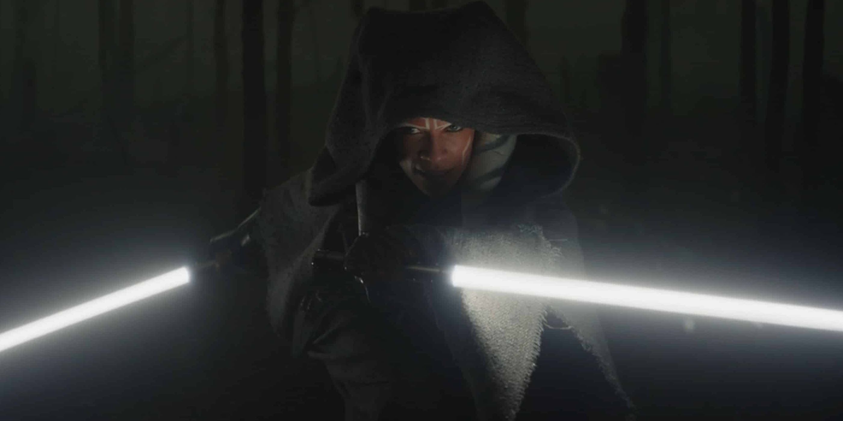 Ahsoka Tano with her lightsabers in the woods in The Mandalorian