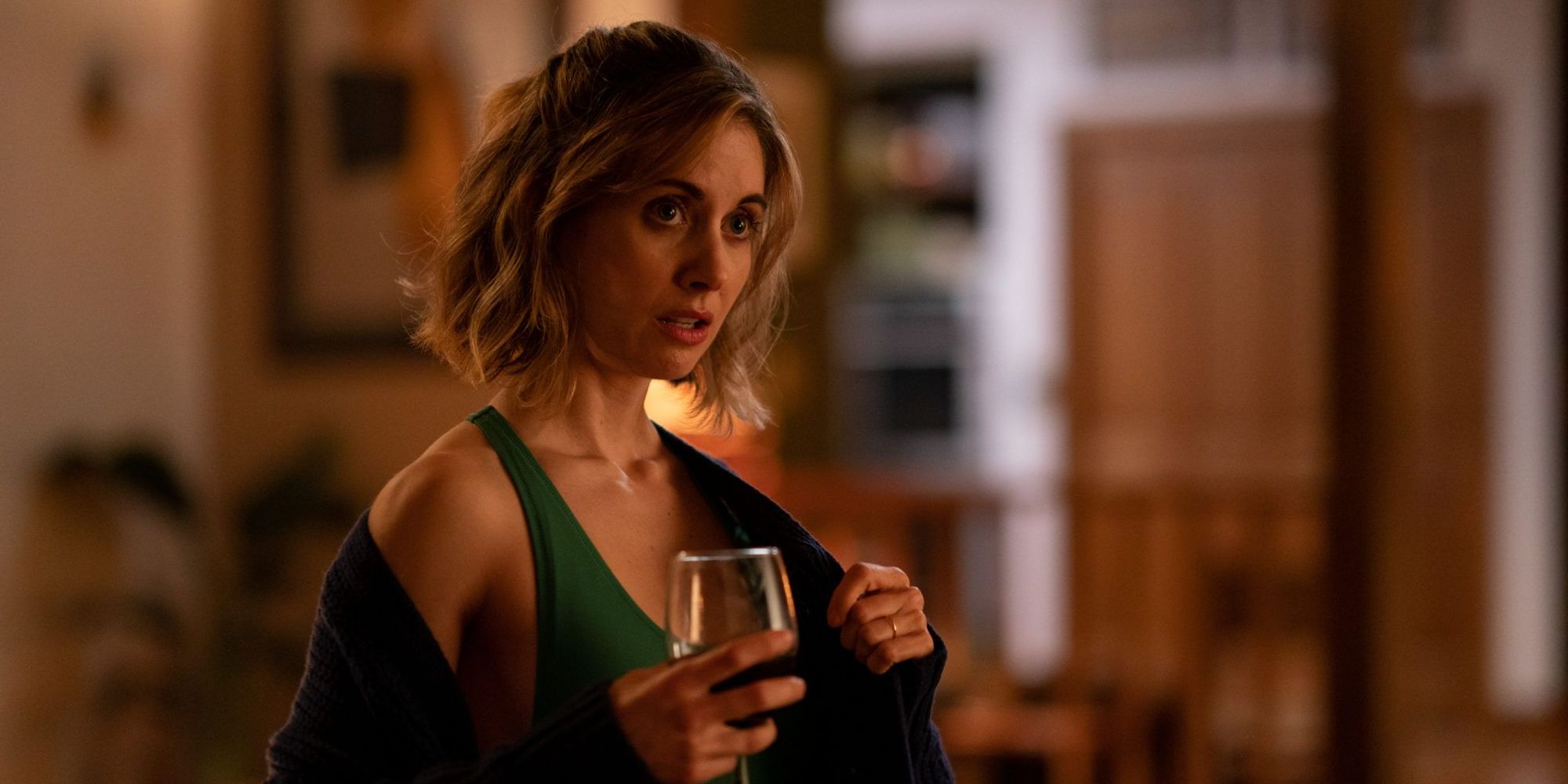 Alison Brie drinking wine as Michelle in The Rental