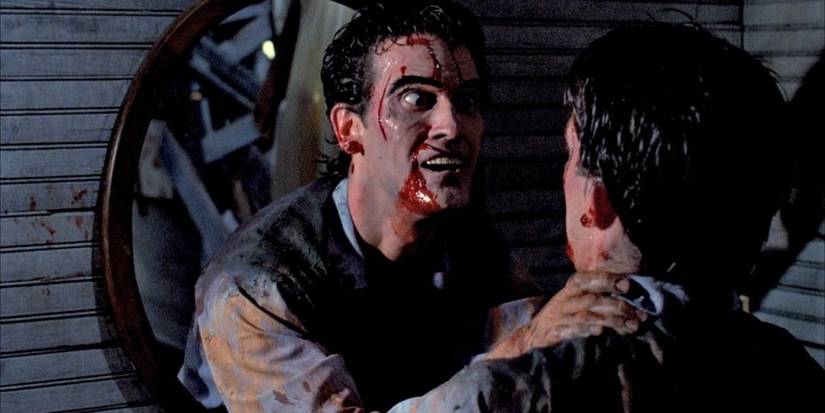 Ash lunges at himself through a mirror in Evil Dead II