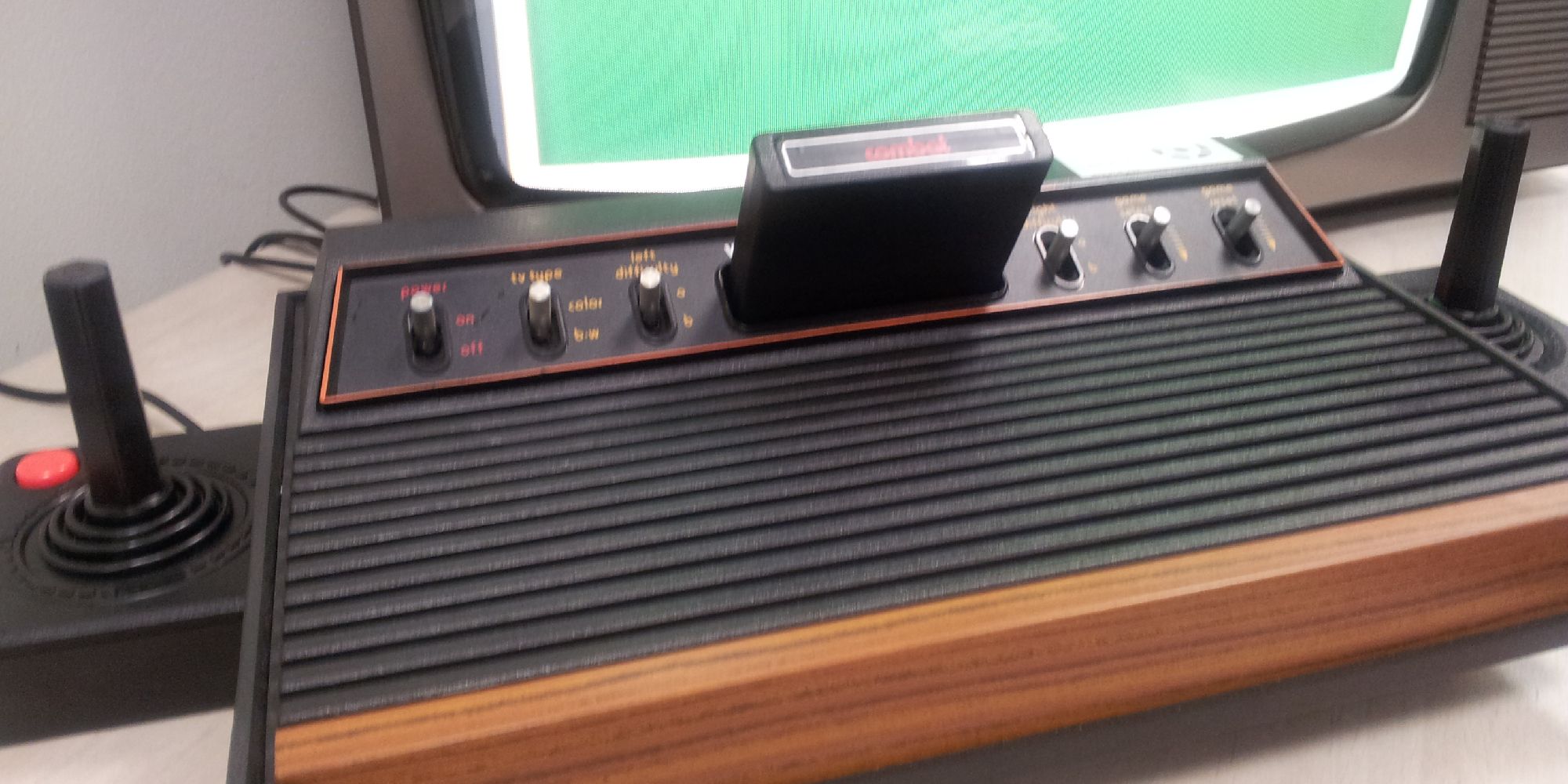 The Atari 2600 with two joystick controllers hooked up to a TV