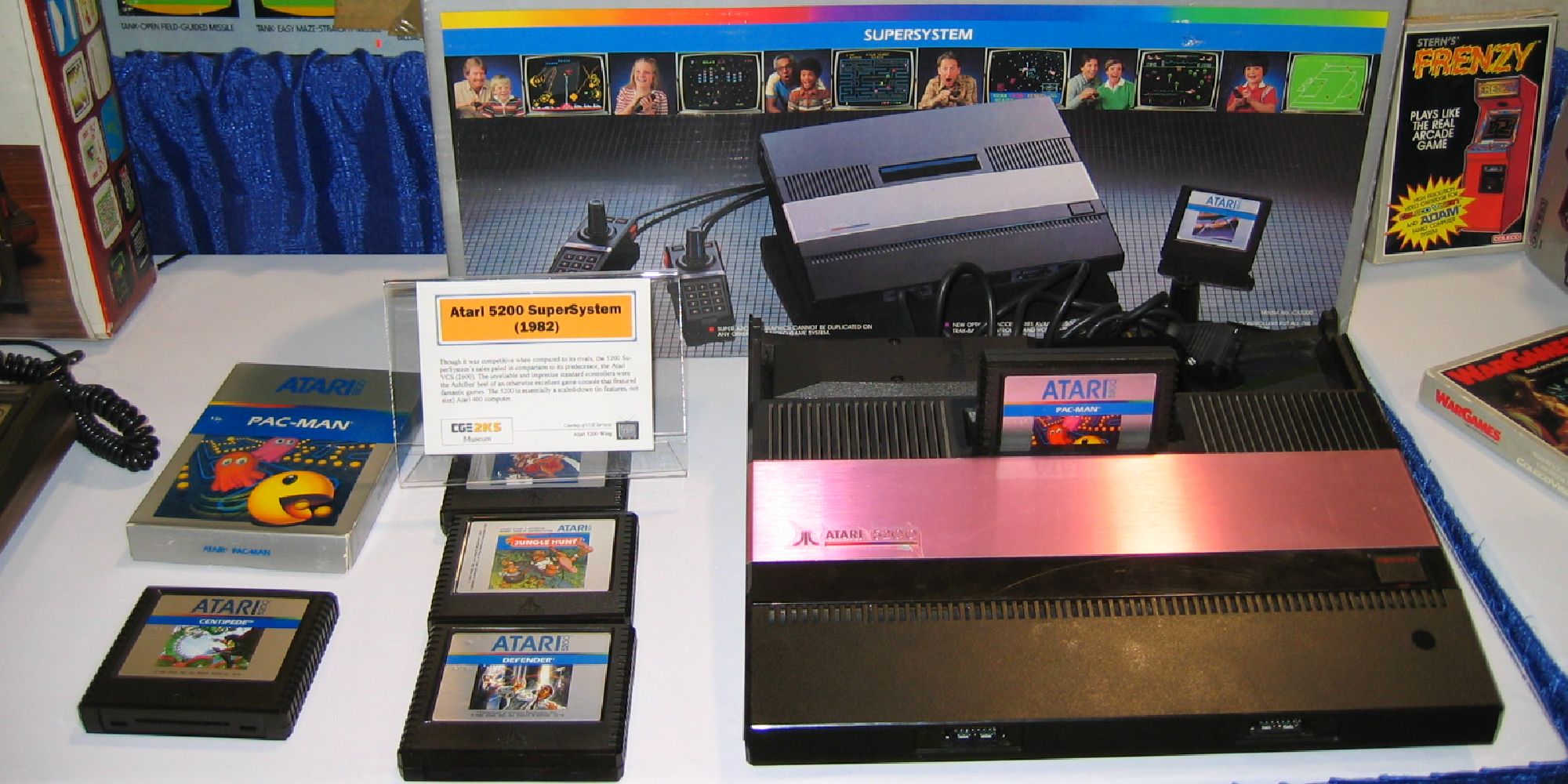 The Atari 5200 on display next to several game cartridges and boxes