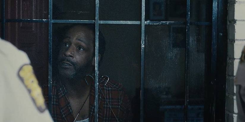 Atlanta Earn's uncle Willy talking to police officers through a screen door