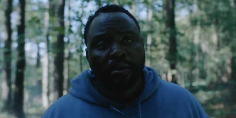 Atlanta Alfred walking through the Atlanta woods during the daytime