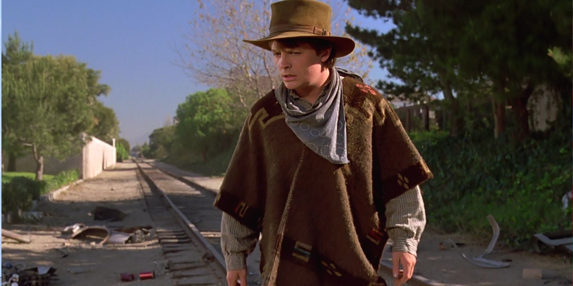 Back To The Future 3 Marty Dresses As A Cowboy On Railroad Tracks Around Wreckage Debree