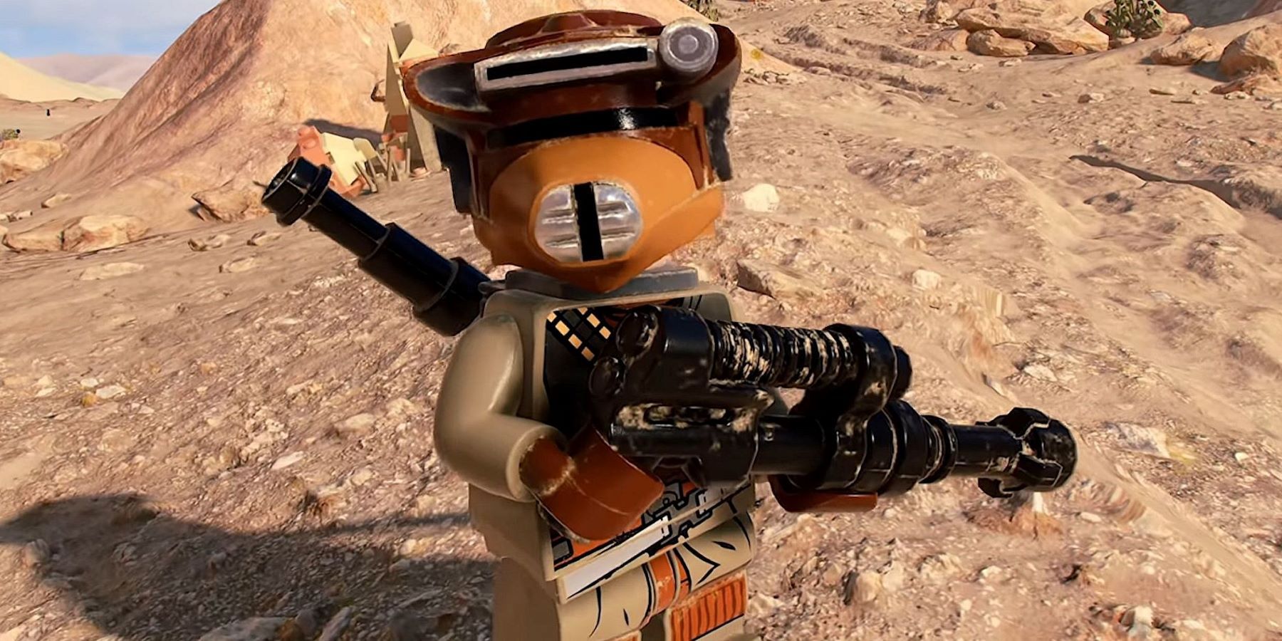 A LEGO bounty hunter standing on a desert planet in LEGO Star Wars: The Skywalker Saga