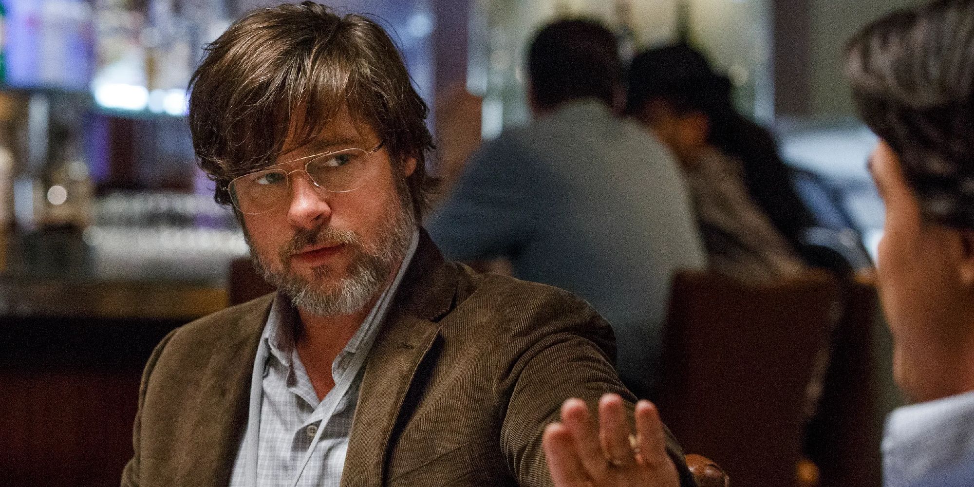 Brad Pitt as Ben Rickert meeting with investors in The Big Short