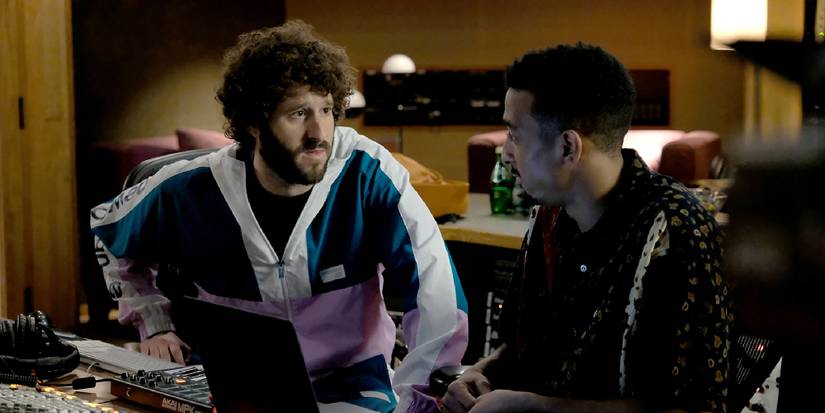 Dave Burd (Lil Dicky) talking to a producer in a recording studio