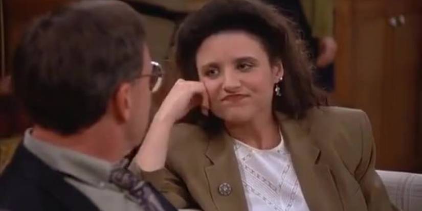 Elaine (Julia Louis-Dreyfus) looking bored at a party on Seinfeld