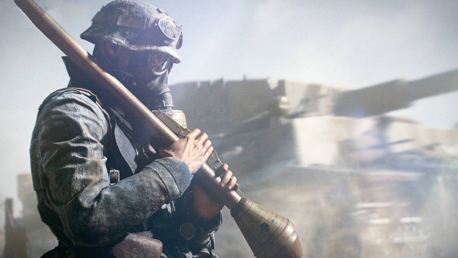 Assault class soldier holds a rocket while wearing a gas mask, with tank in background. From Battlefield 5