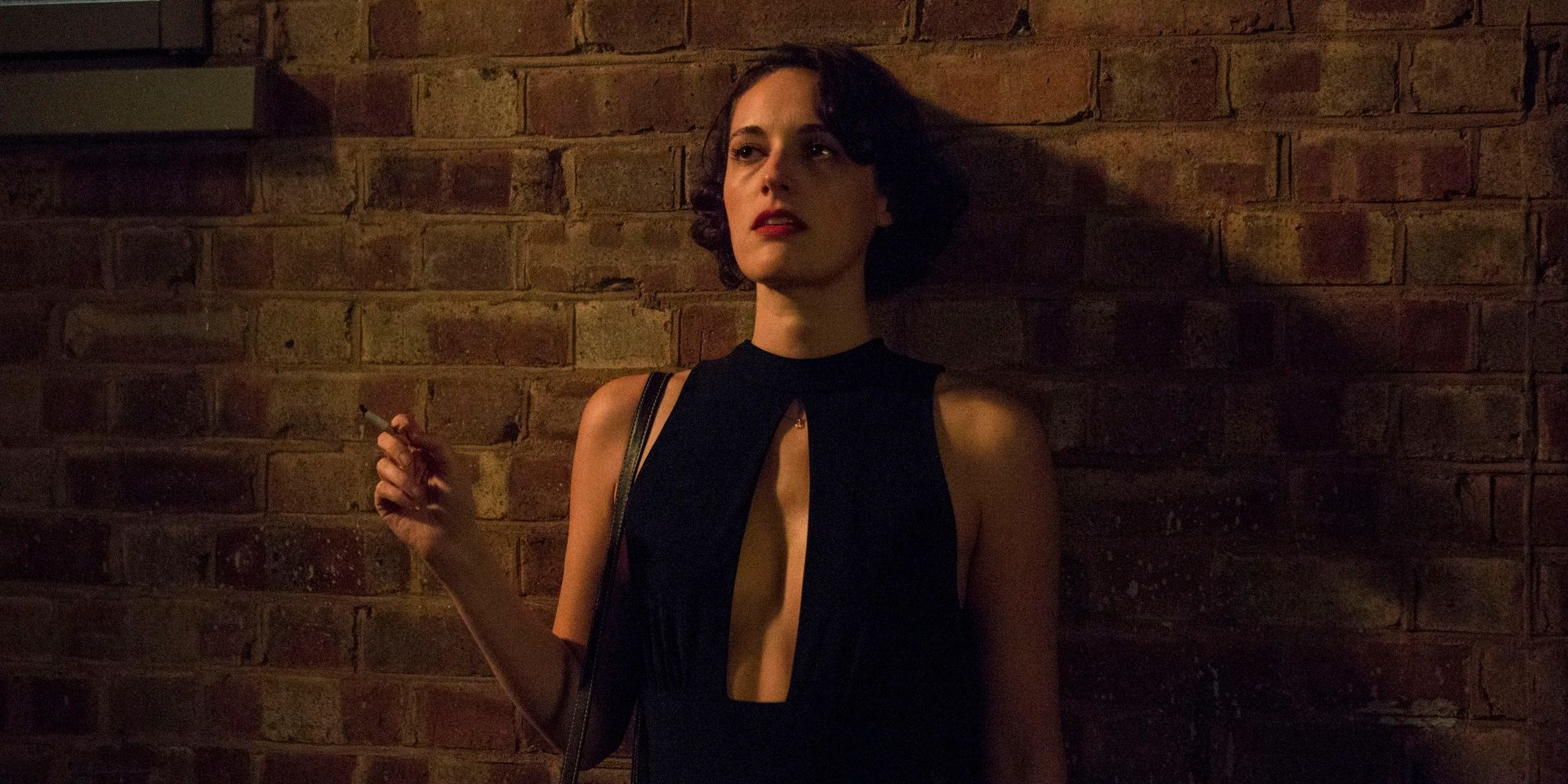 Fleabag smoking outside the restaurant in Season 2 Episode 1