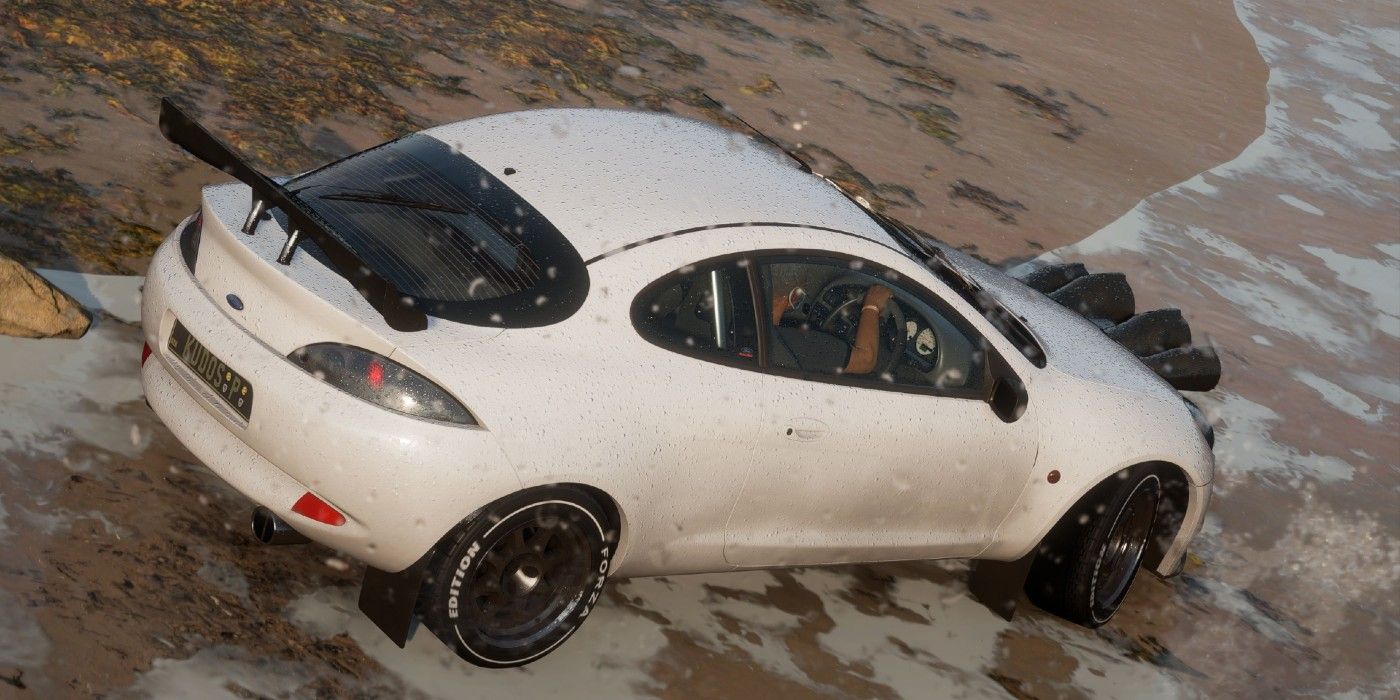 Forza Horizon 5 Ford Racing Puma (Forza Edition) skidding on beach in rainy shot