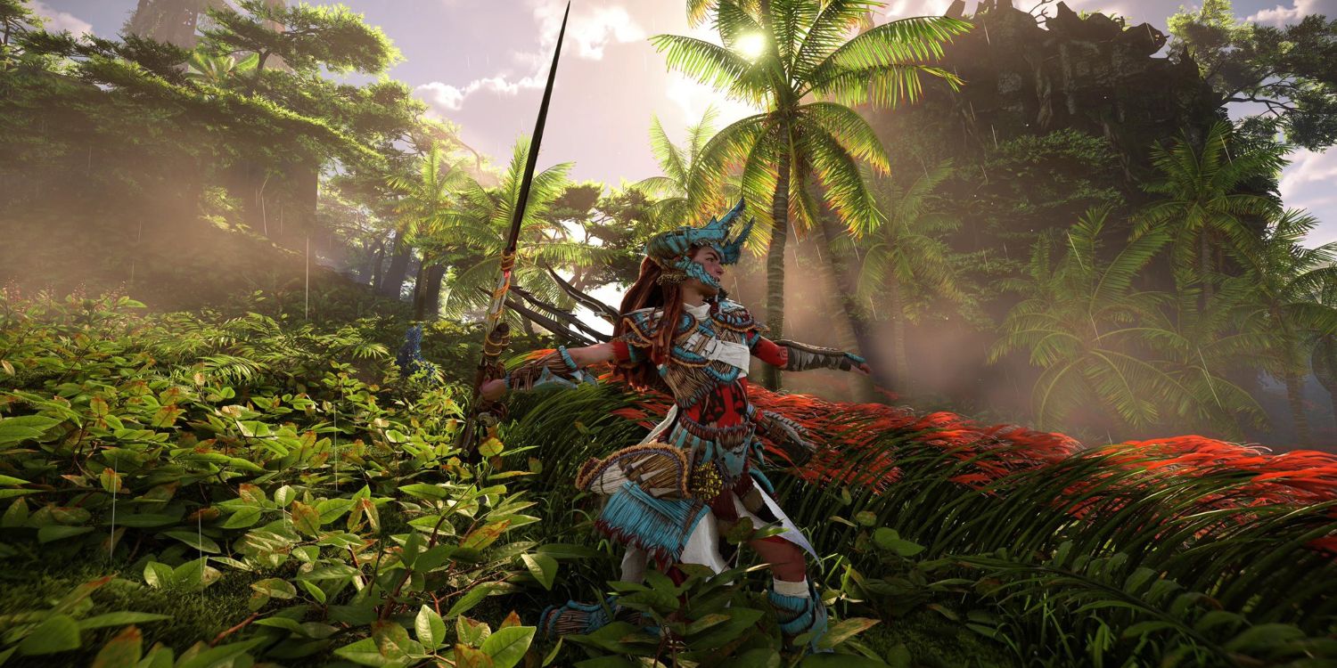 Aloy in a red, white, and teal outfit with a horned helmet standing a field and pulling back to throw a long, metal spear 