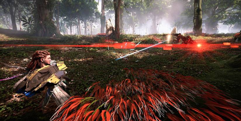 aloy firing a large, yellow gun at a distant robot in a forest clearing