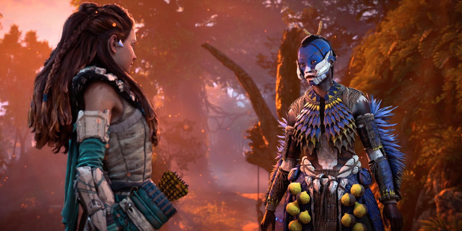 Aloy speaking to a tenakth soldier in blue and yellow, feathered armor with blue and white face paint