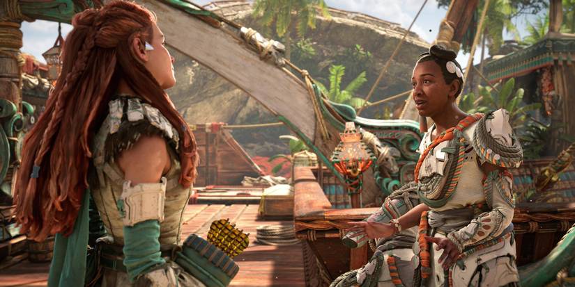 aloy with her back turned speaking to a woman with white clothing and her hair in a bun