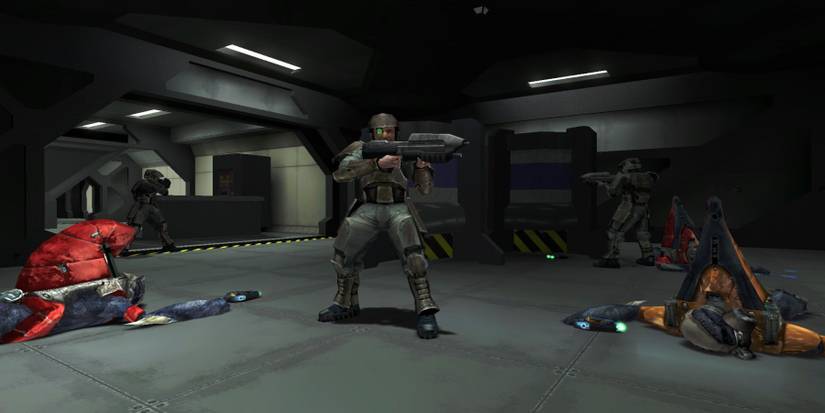 A marine surrounded by dead enemies aboard the Pillar of Autumn