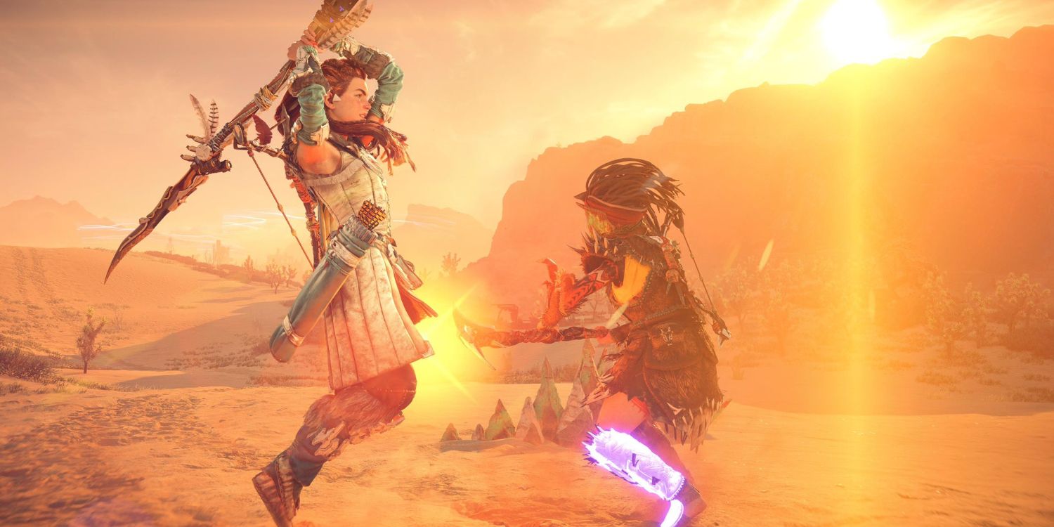 Aloy swinging her spear over her head to bring down on an enemy soldier in mid-attack with a desert cliff in the background