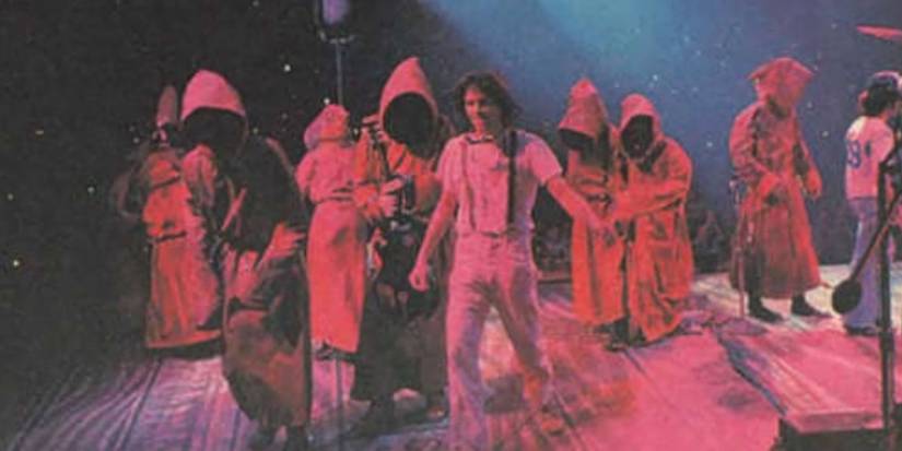 Star Wars Jawas Road Eyes Neil Young shot of robed Road Eyes on stage 