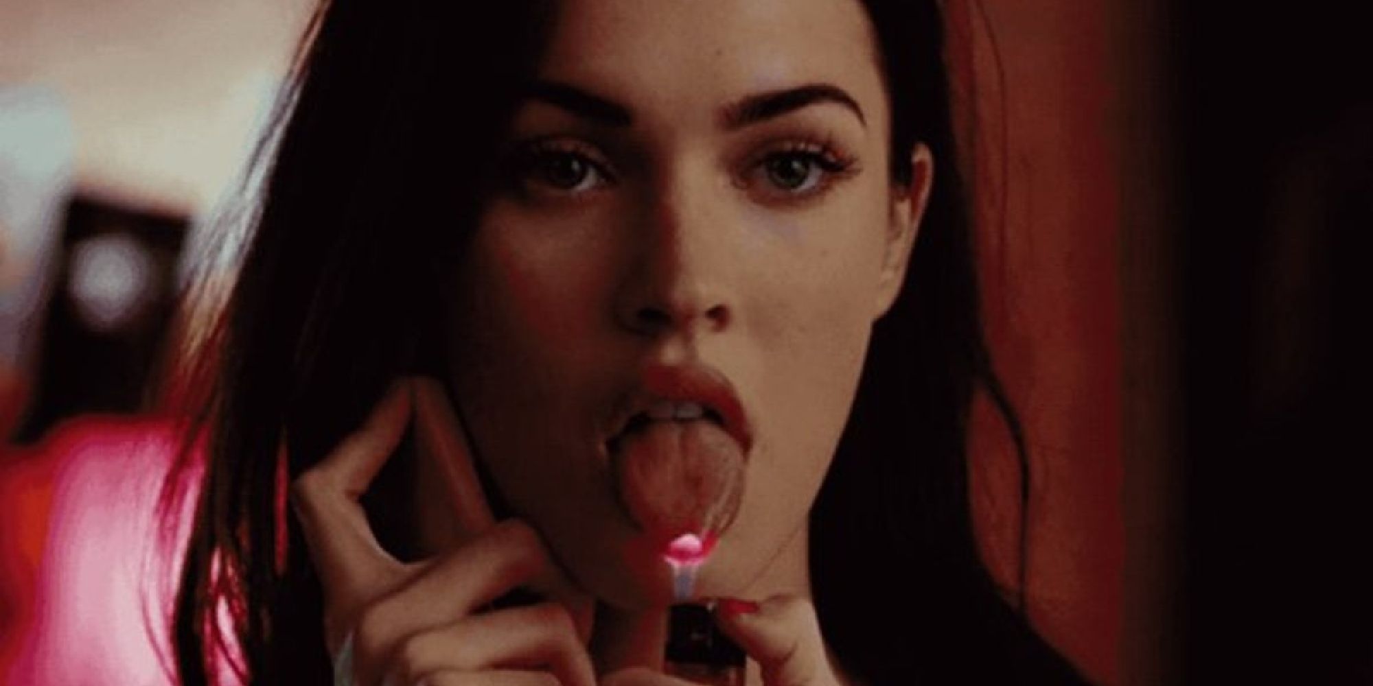 Megan Fox as Jennifer lighting her tongue with a lighter in Jennifer's Body