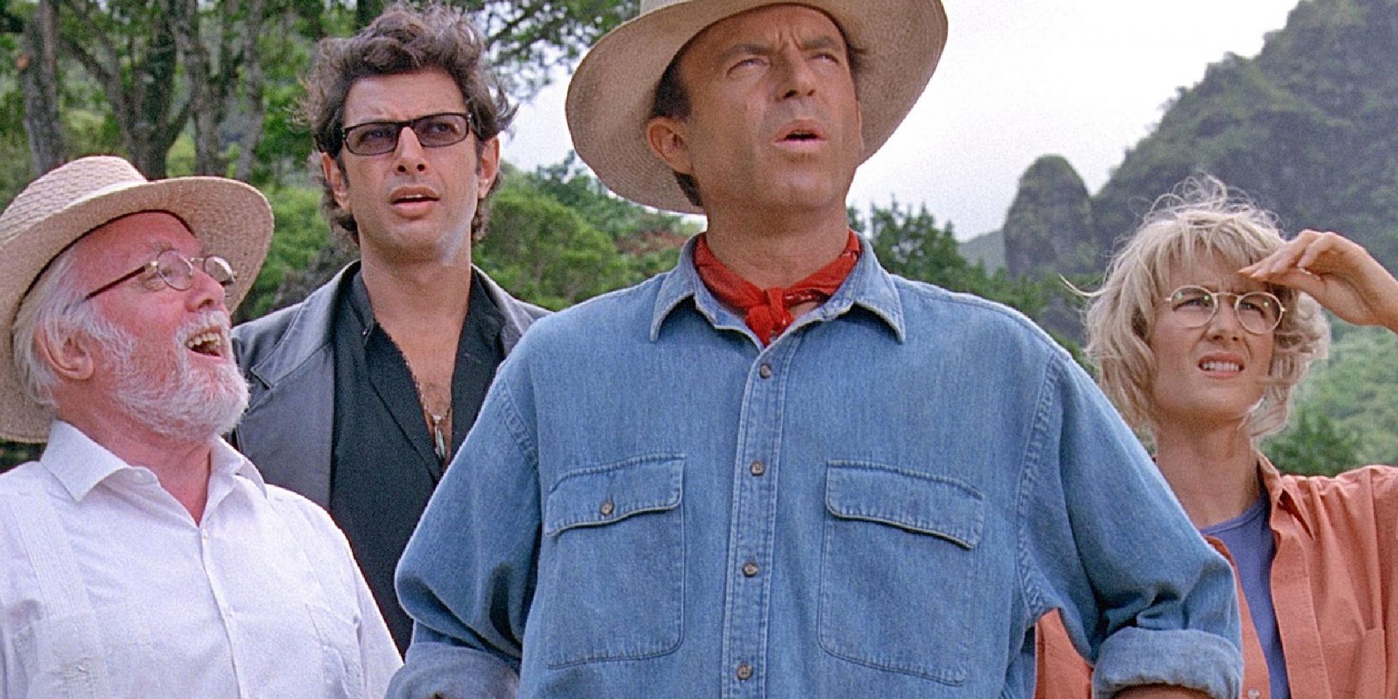 Sam Neill, Laura Dern, Jeff Goldblum, and Richard Attenborough observing Jurassic Park