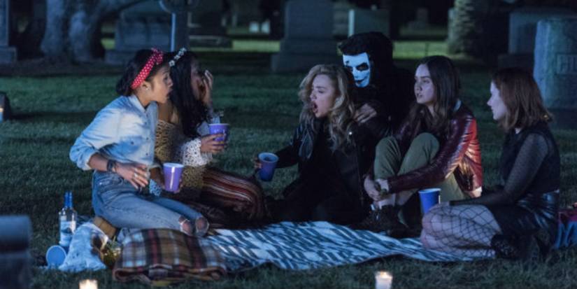 The main characters having a picnic outside in Light As A Feather