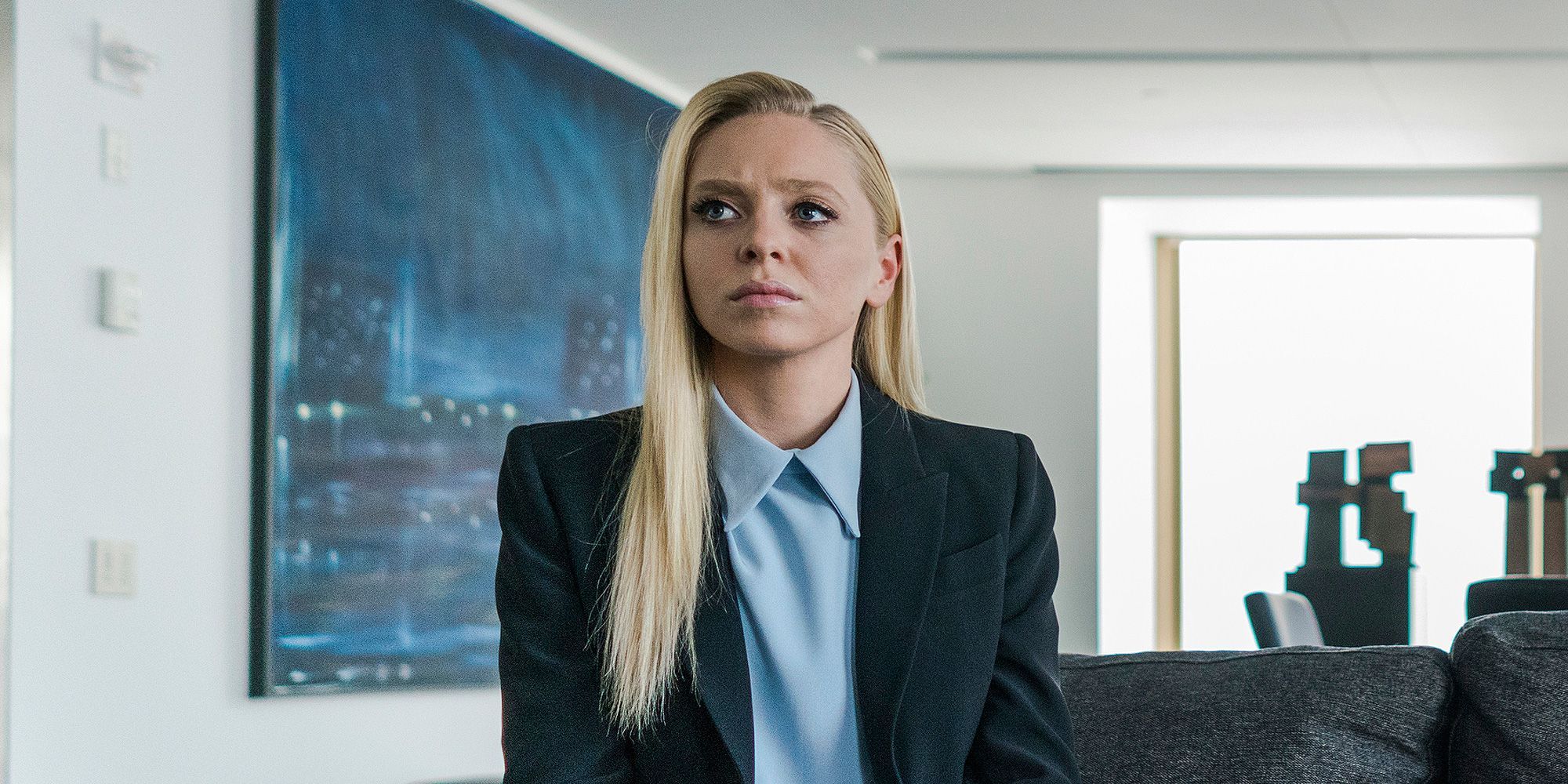 Angela Moss from Mr. Robot sitting in the company office