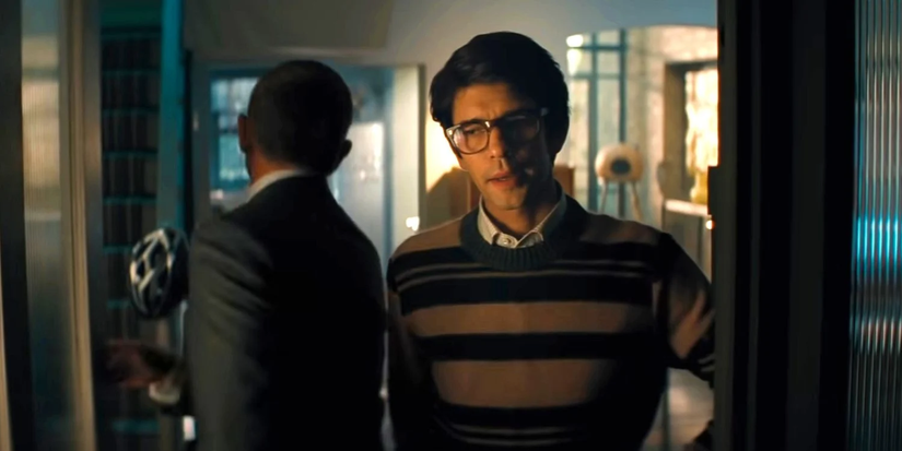 James Bond walking past annoyed Q