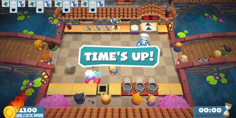 Overcooked 2 time's up message on kitchen with bridges and fire tip