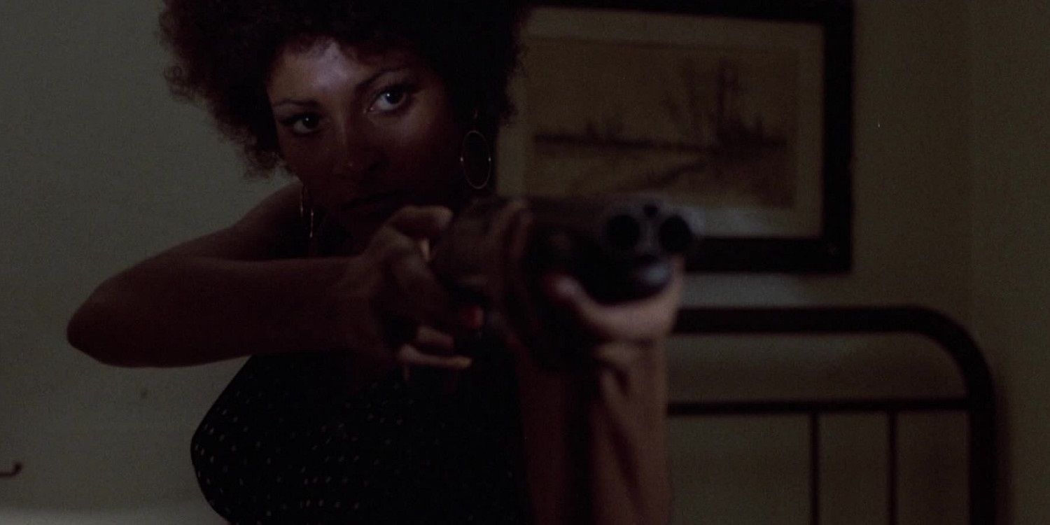 Pam Grier armed with a shotgun