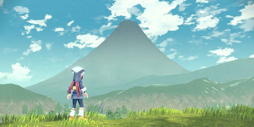A player looking up at Mount Coronet as it appears in Pokemon Legends: Arceus