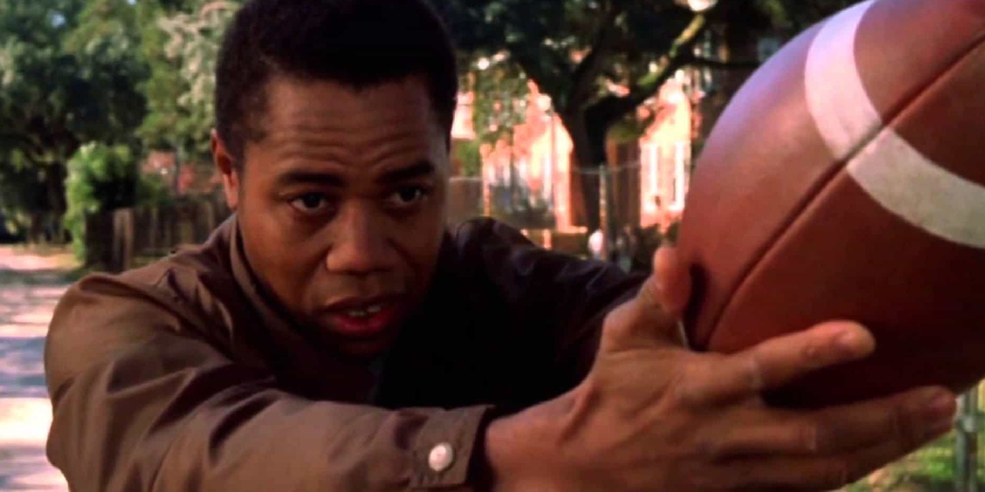 Cuba Gooding Jr as Radio holding a football in "Radio"