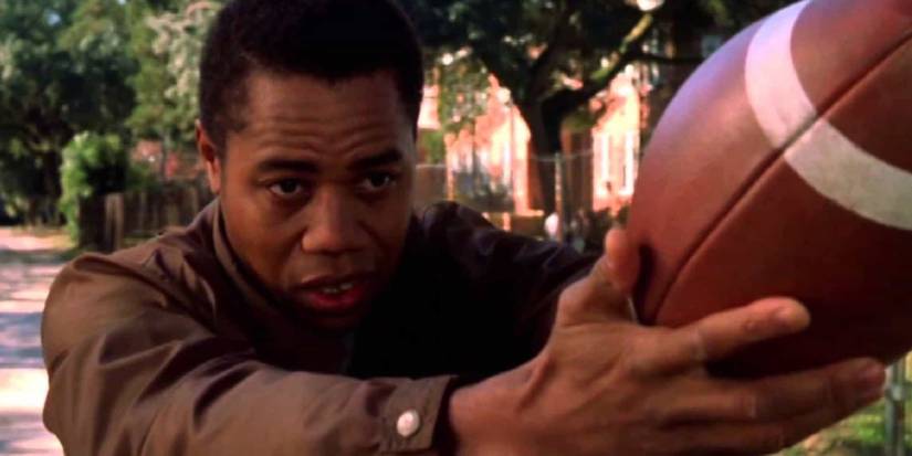 Cuba Gooding Jr as Radio holding a football in "Radio"