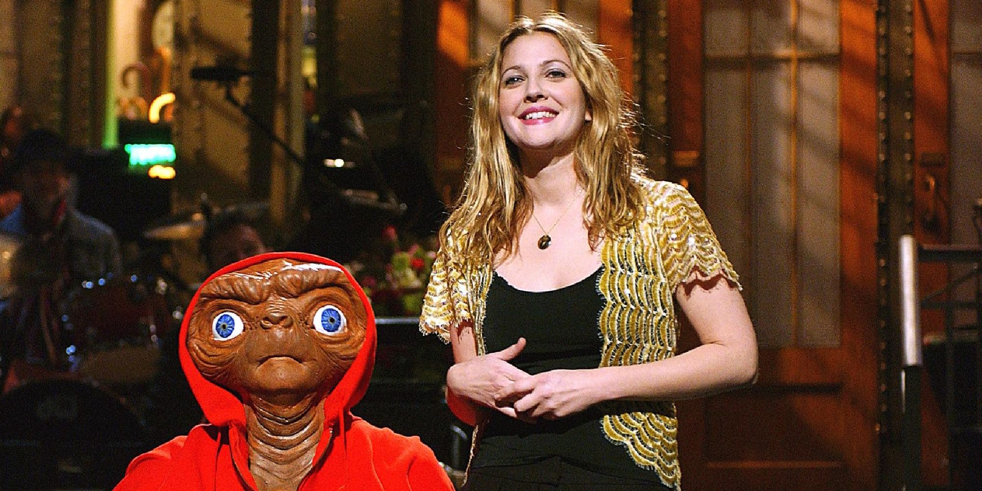 Drew Barrymore appearing with E.T. in her monologue