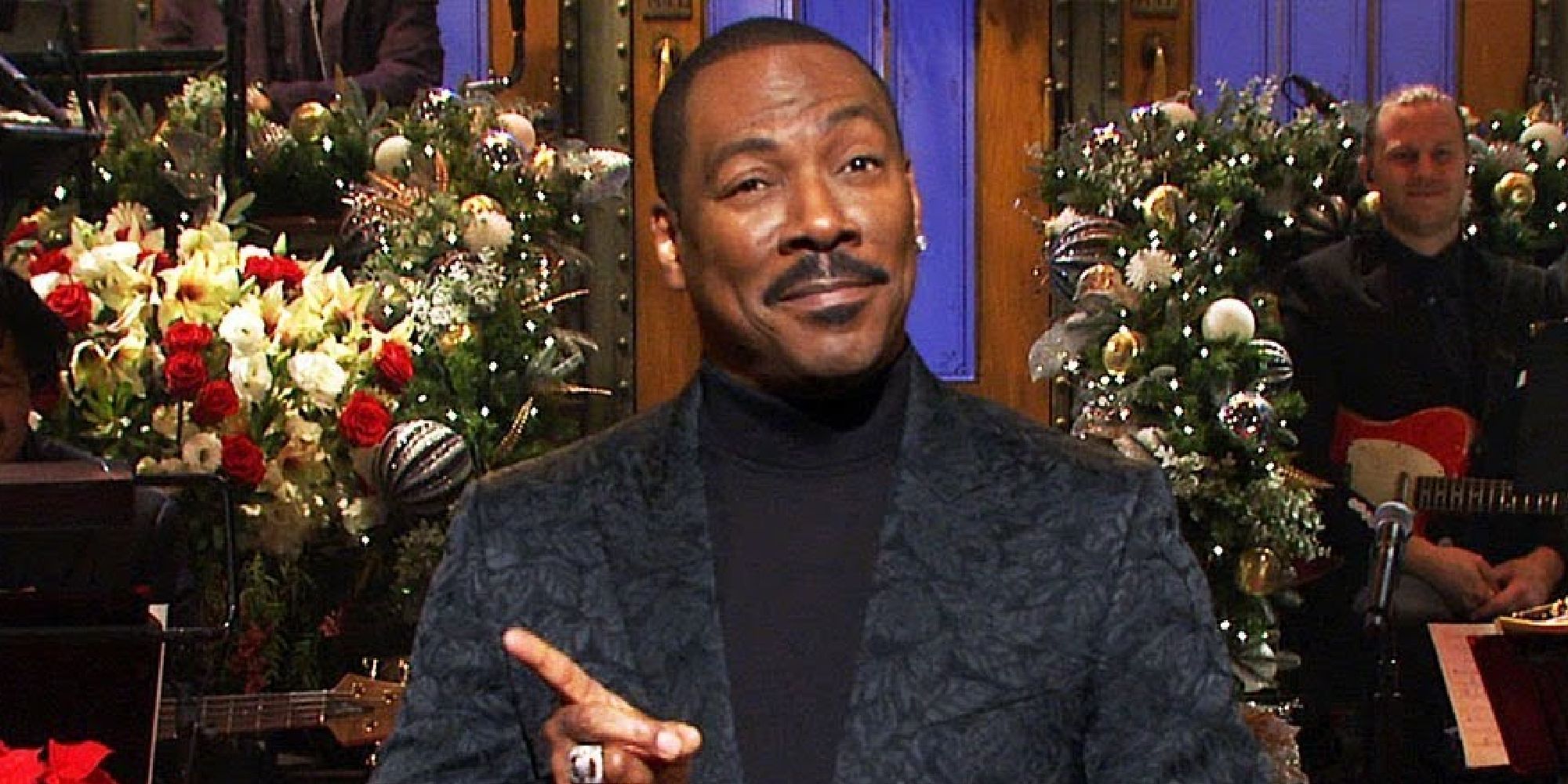 Eddie Murphy appearing during his monologue in 2019