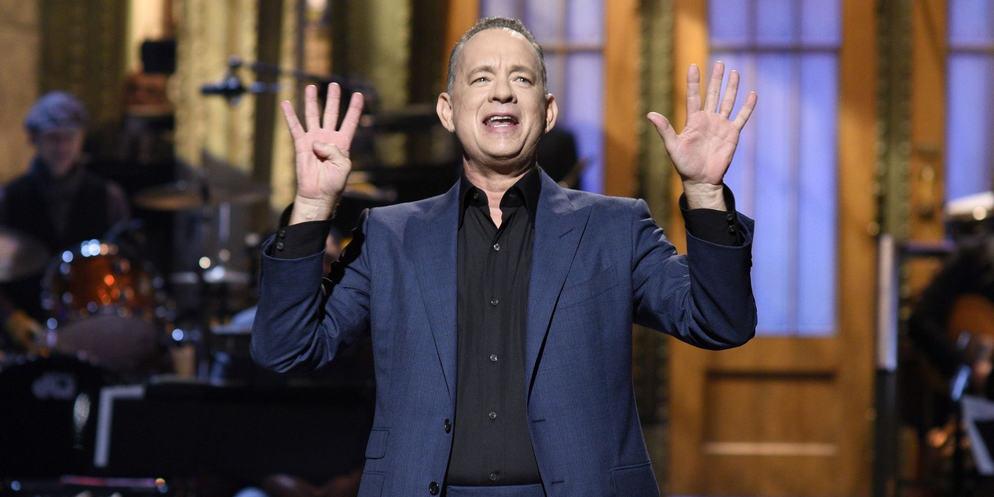 Tom Hanks appearing during his monologue in 2016