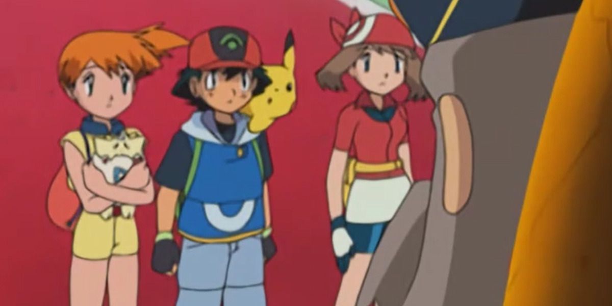 Pokemon Misty holding Togepi with Ash and May