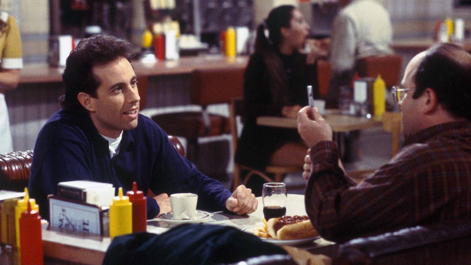 Jerry (Jerry Seinfeld) and George (Jason Alexander) at Monk's restaurant on Seinfeld