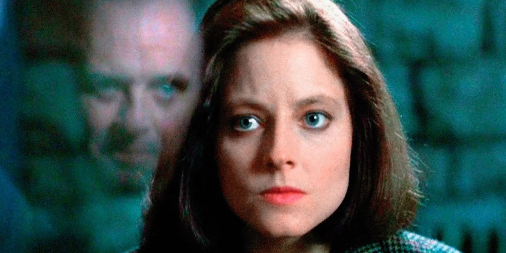 Clarice Starling talking to Hannibal Lecter through a glass window in The Silence of the Lambs