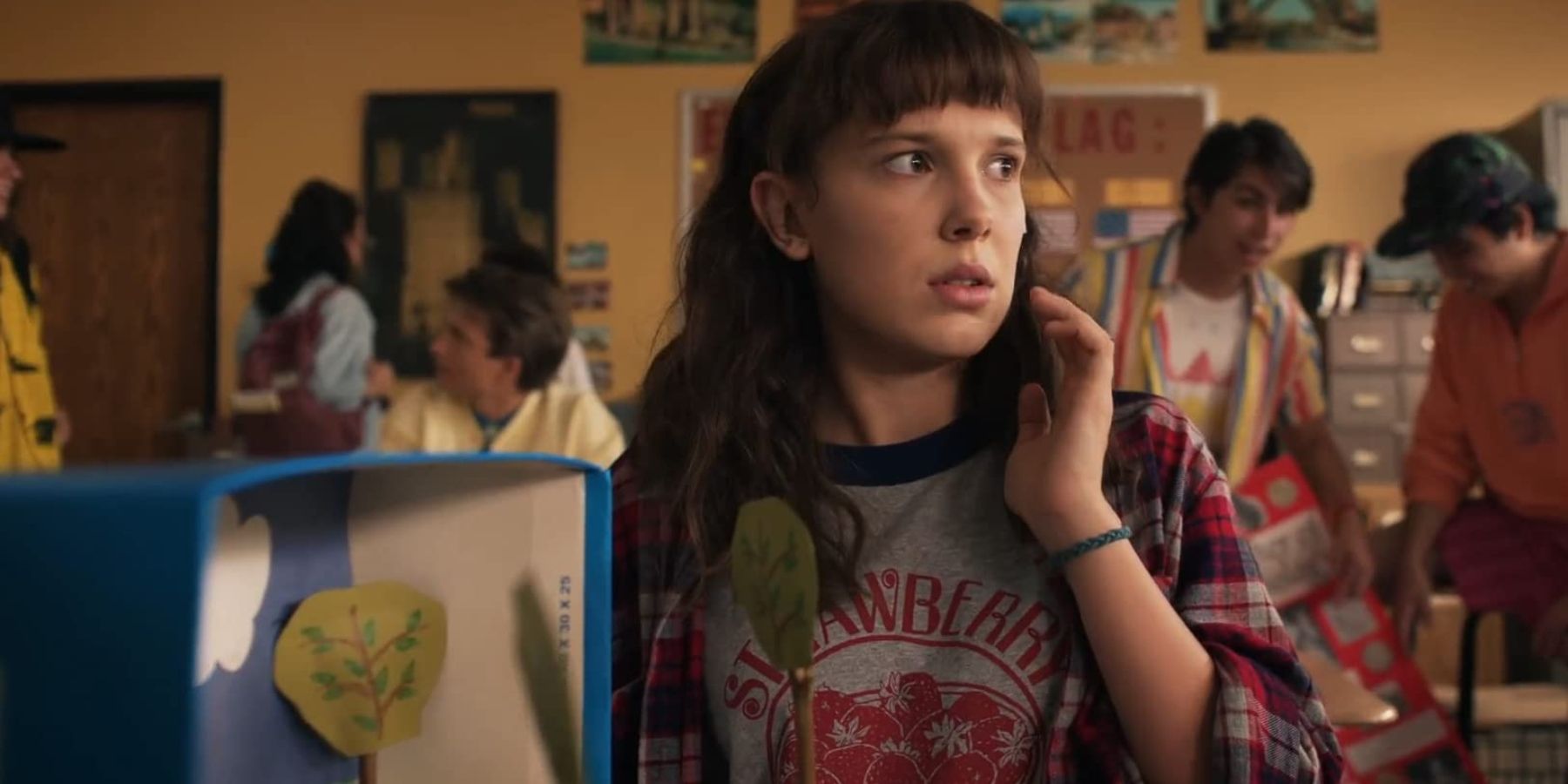 Millie Bobby Brown as Eleven talking on the phone in Stranger Things