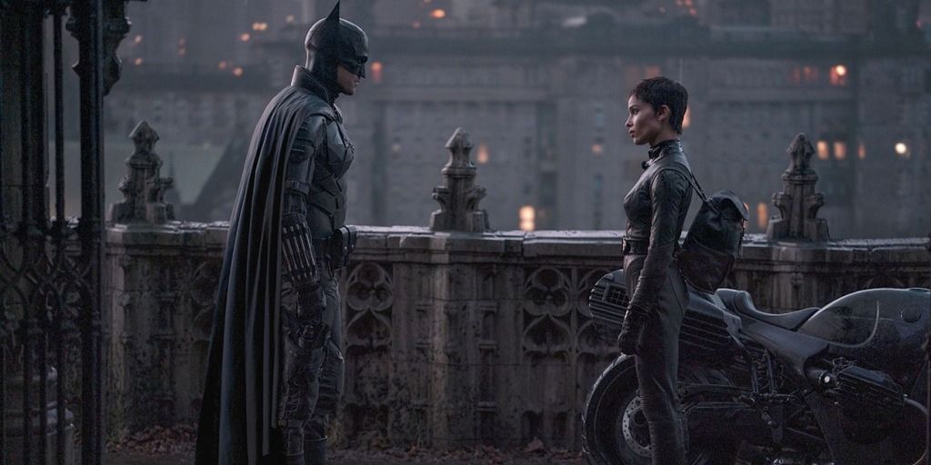 The Batman and Catwoman looking at each other