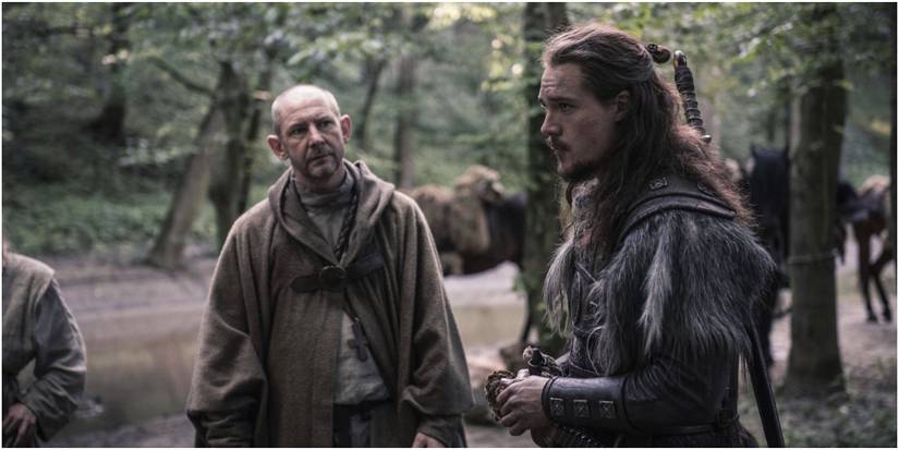 The Last Kingdom Picture of Uthred and Father Beocca Standing in the Woods