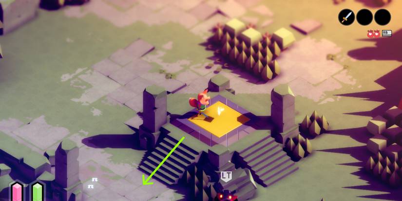 tunic on a raise, golden platform that's flanked by crumbling, stone pillars. In the middle of the platform is a glowing white page. a green arrow points off at a downward angle to the left from the platform