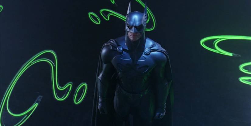 Val Kilmer's Batman standing in the Riddler's lair in Batman Forever
