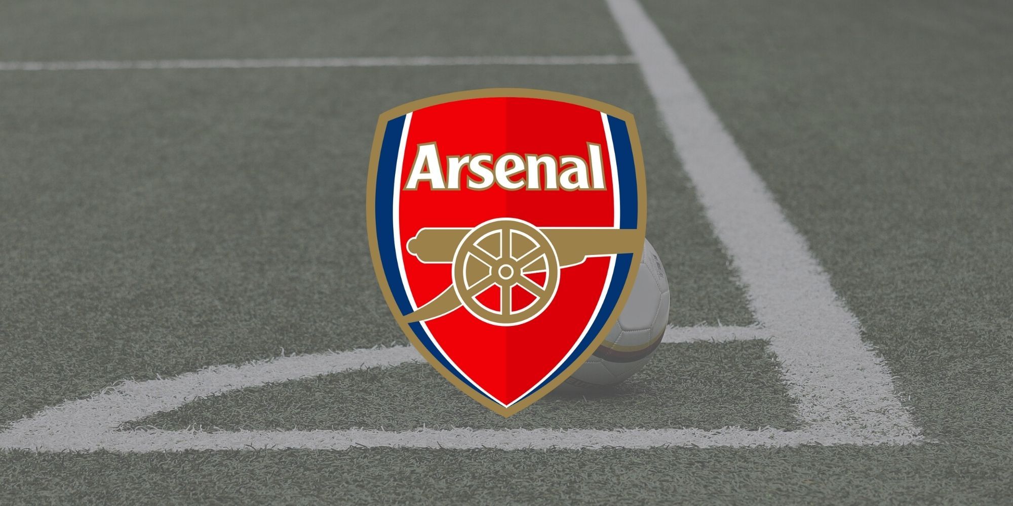 The official Arsenal FC club badge over an image of a football field.