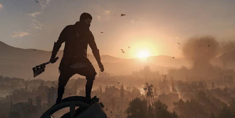 Image from Dying Light 2 showing a character wielding a weapon as they look out over the city during sunset.