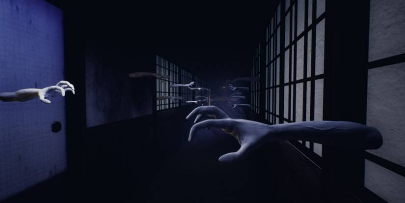 ghostly hands and arm reaching out of walls in Ikai